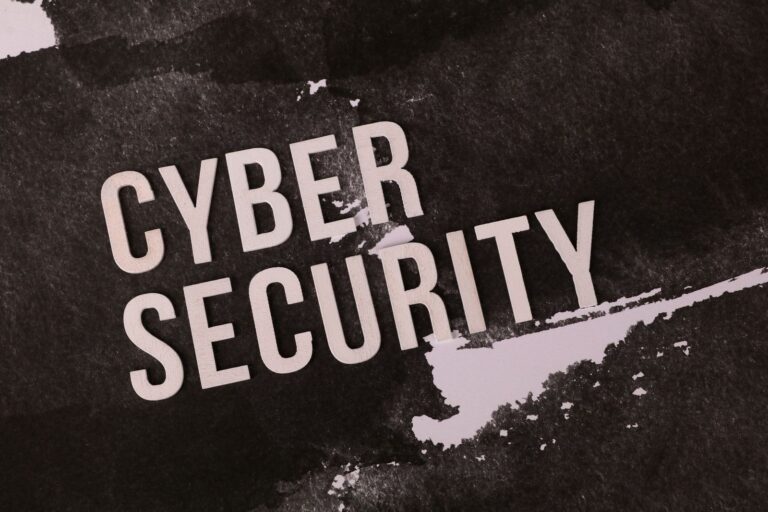 Cyber security text on a dark grunge background, representing antivirus protection for gaming PCs