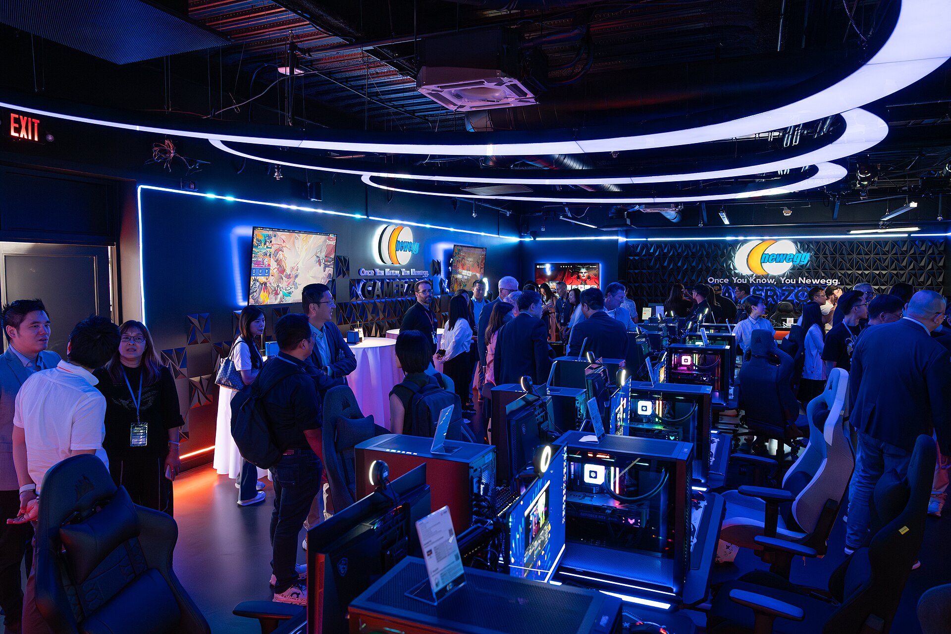 A gamer zone gaming setup with multiple monitors and gaming PCs